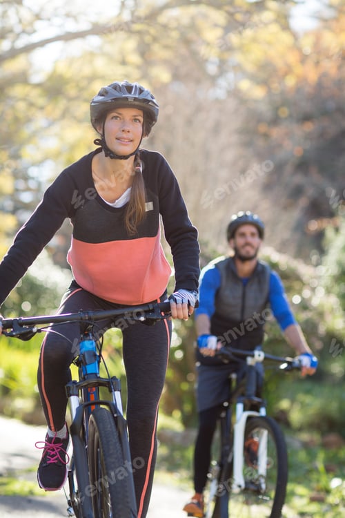 Preview: Smiling Biker Couple Cycling In Countryside