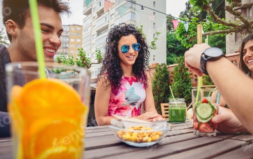 Preview: Young woman talking with friends in a summer day
