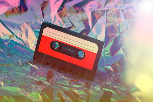 Preview: old cassette tape on crumpled neon background. retro and nostalgia style. vintage music concept.