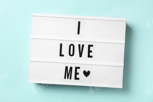 Preview: Light box with phrase I Love Me on blue background, top view