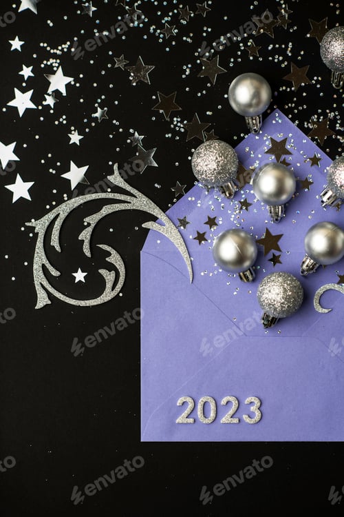 Preview: Happy New Year 2023 greeting card. Purple envelope with silver Christmas balls on black background