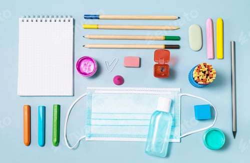 Preview: School supplies, face mask, bottle of sanitizer.