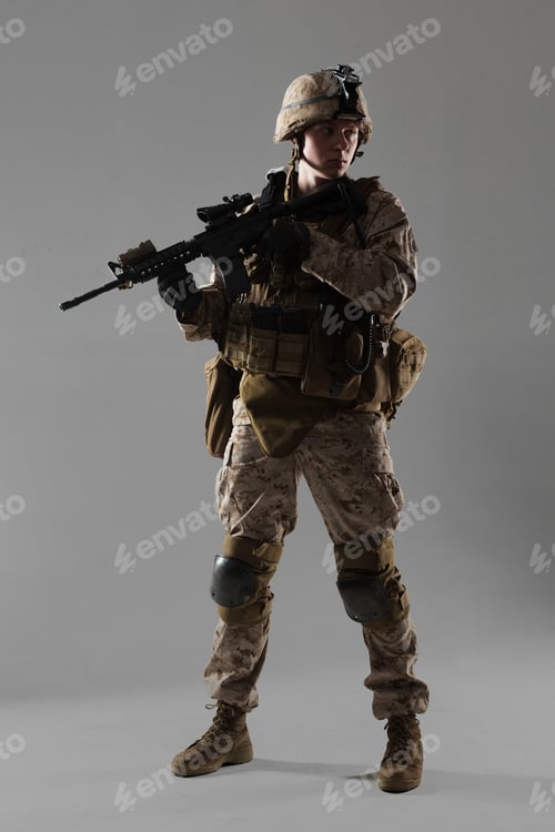 Preview: Soldier stands ready with rifle in a studio setting during a training exercise