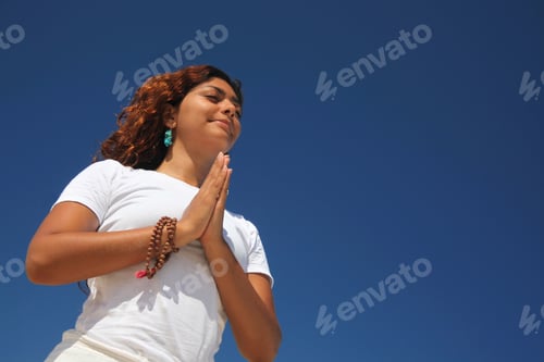 Preview: Young woman with hands together on beach, Paradise Island, Nassau, Bahamas