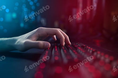 Preview: Shot of an unrecognisable man using a keyboard while playing computer games