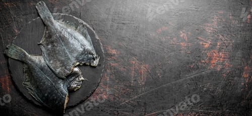 Preview: Raw fish flounder on a stone Board.