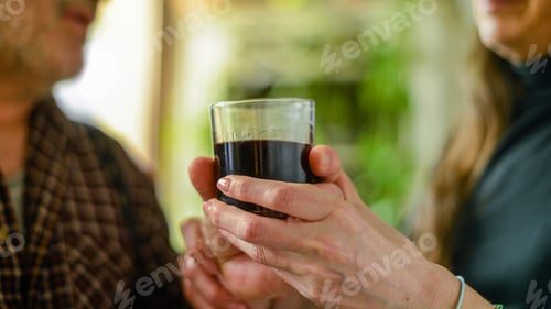 Preview: Closeup of a caucasian man drinking wine and getting drunk at home