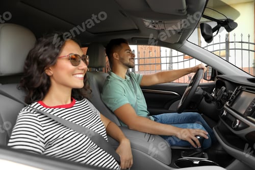 Preview: Happy young couple traveling by family car on summer day