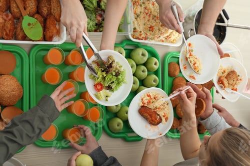 Preview: Volunteers serving food for poor people indoors, view from above