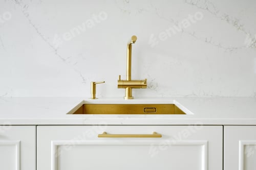 Preview: Stylish kitchen sink with gold faucet and white countertop in modern interior