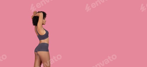 Preview: Black fit woman stretching arms in underwear, top and shorts, free space