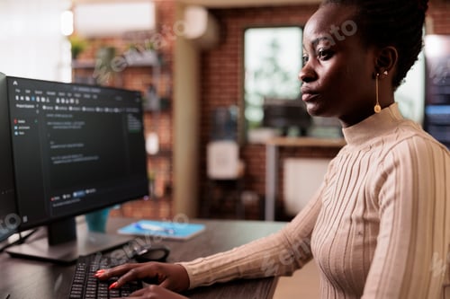 Preview: African american programmer typing big data code on compute