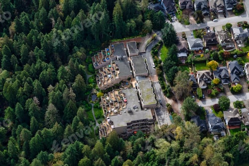 Preview: Aerial View of Residential Homes in a green neighborhood during a sunny morning