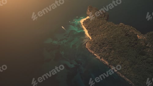 Preview: Sunset top down of hilly tropical island at ocean gulf in aerial view. Amazing sun set light