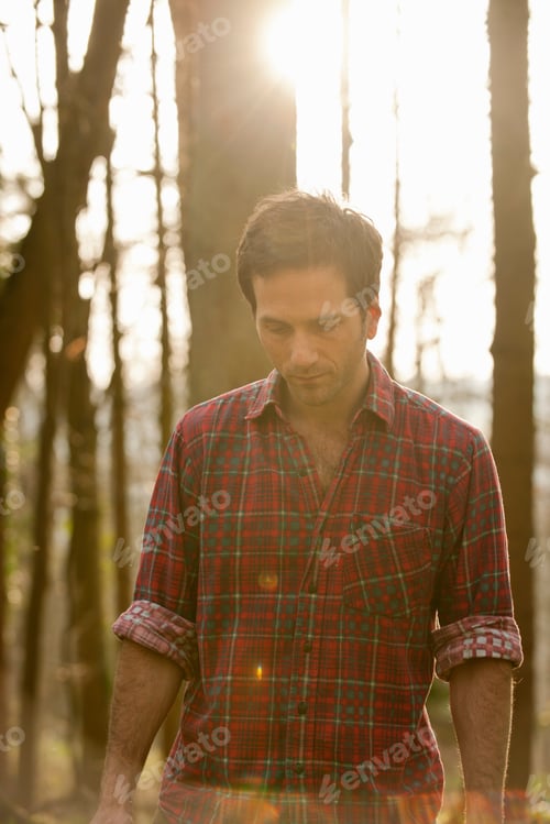 Preview: Man walking in forest