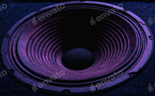 Preview: Close-up of speaker membrane on black background.