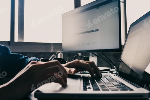 Preview: Close up of Male hands using computer on the desk.