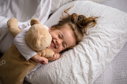 Preview: little girl in bed with soft toy the emotions of a child