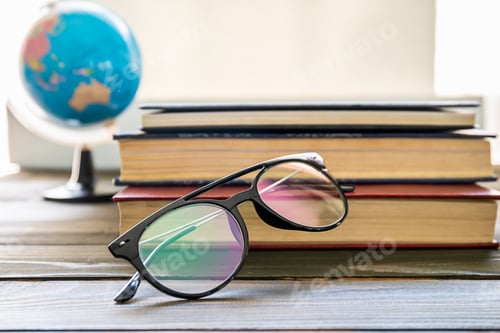 Preview: Books, Globe, and Glasses on a Wooden Table