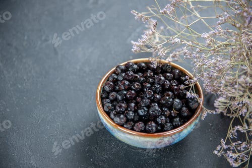 Preview: bottom view black currant in bowl on isolated background free place