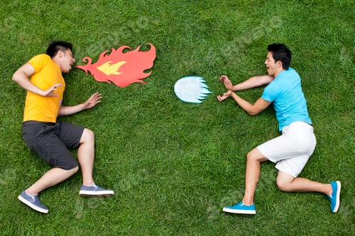 Preview: Creative young man imitating fighting on meadow