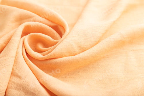 Preview: Fragment of orange linen tissue. Side view, natural textile background.
