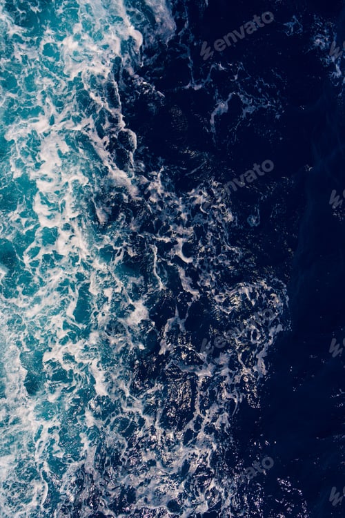 Preview: Aerial View of Dark Ocean Waves with White Seafoam