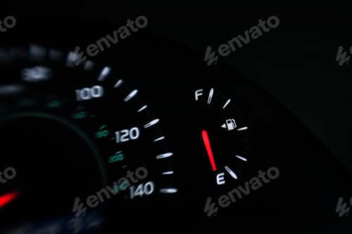 Preview: Close up of gas gauge on empty in a car.