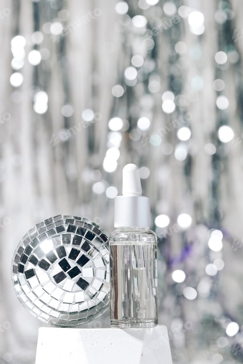 Preview: cosmetic bottles on a New Year's background. new year cosmetics