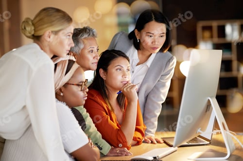 Preview: Business, women and creative collaboration on computer at night in office for teamwork, planning or