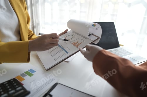 Preview: Business People Meeting to discuss and brainstorming the financial report paperwork in home office