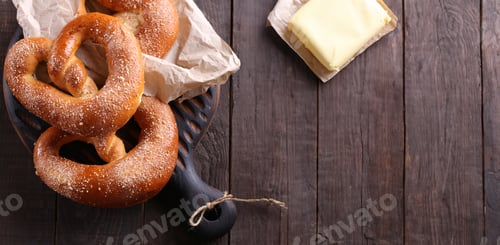 Preview: traditional pretzel buns on a wooden board