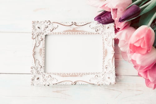 Preview: Photo frame and bouquet of fresh tulips on a light background