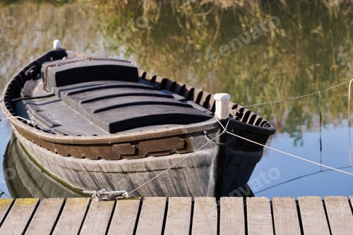 Preview: albufera wooden boat moored at the wharf Albuferenc or Barca Levantine boat