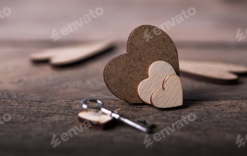 Preview: Little red heart shape on dark wooden background. Saint valentines, love greeting card and invitatio