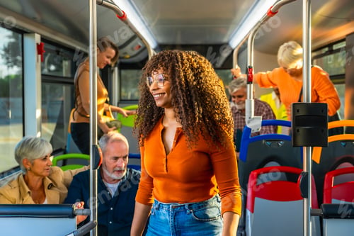 Preview: Smiling woman traveling by bus with diverse passengers
