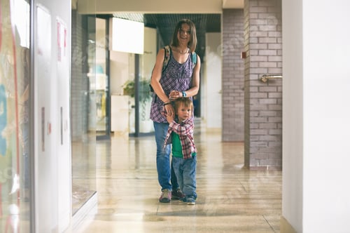 Preview: Mum and the son walking in the shopping center
