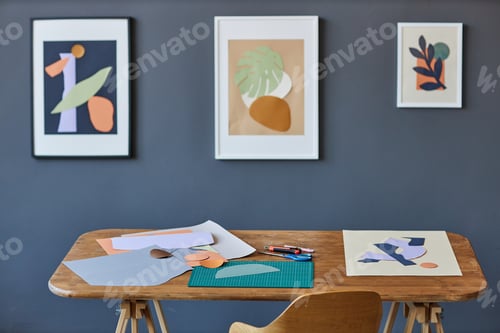Preview: Workplace of creative designer with papers of various colors and other supplies
