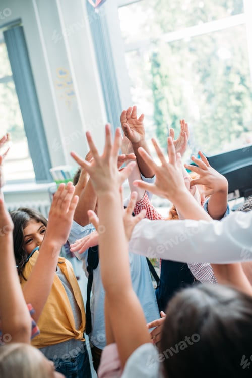 Preview: big team of funny kids raising hands