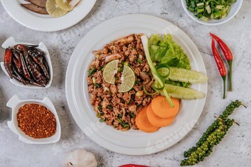 Preview: Pork Larb with carrot, cucumber, lime, spring onion, chili, freshly ground pepper, and lettuce