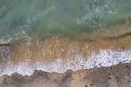Preview: Aerial drone view of waves and beach in Wales, UK