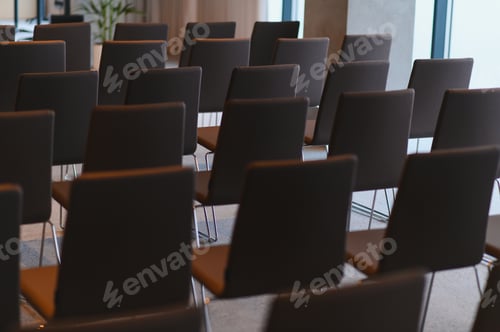 Preview: Empty chairs in a modern conference room for seminars