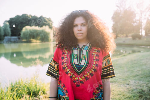 Preview: Young woman by lake