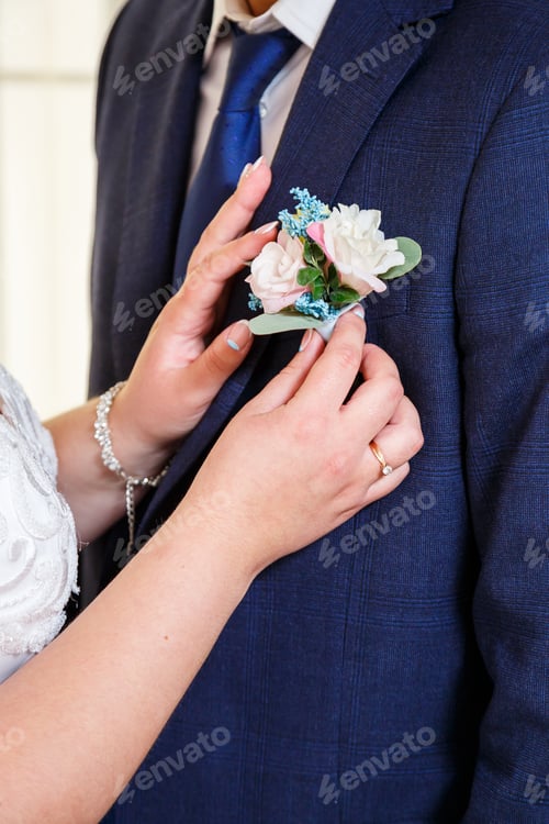 Preview: Beautiful wedding bouquet of flowers in the hands of the newlyweds