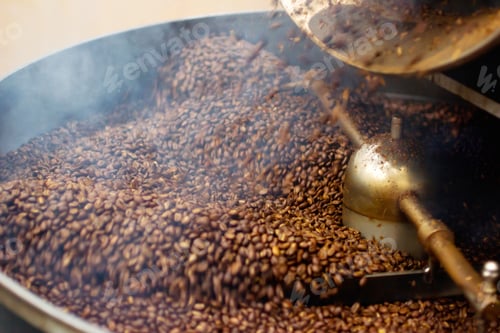 Preview: Coffee for all the senses. Closeup shot of coffee beans being roasted.
