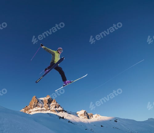 Preview: Skier jumping across skyline