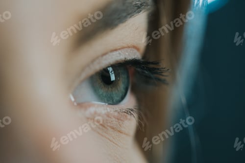 Preview: Closeup shot of a beautiful blue eye with specks of gold