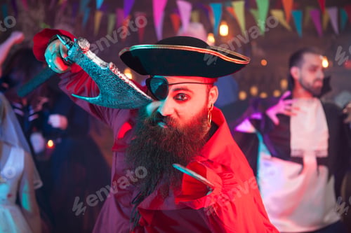 Preview: Scary man dressed up like a party holding an axe at halloween celebration