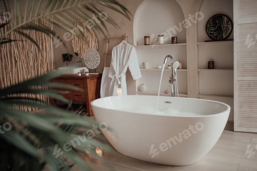 Preview: Luxury interior of big bathroom at modern african style with oval bathtub in natural lighting