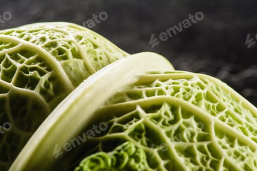 Preview: close-up view of fresh healthy savoy cabbage on black